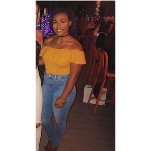 Yellow off the shoulder body suit